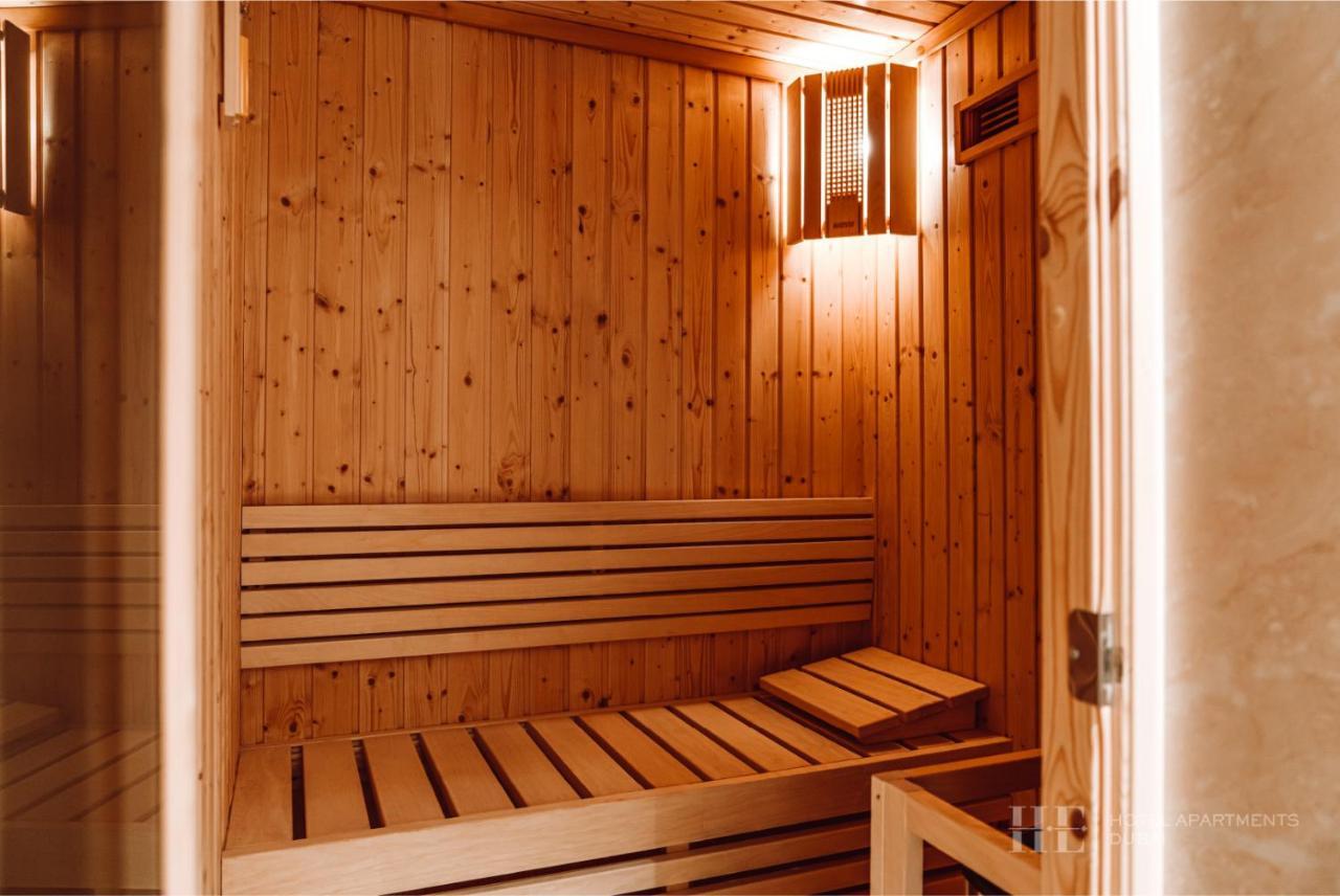 He Hotel Apartments Dubai Exterior photo A Finnish sauna